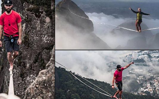 கடலுக்கு நடுவே ஆயிரம் அடி உயரத்தில் இரு பெரும் பாறைகள் ; கயிற்றில் நடந்து இளைஞர் சாதனை!!