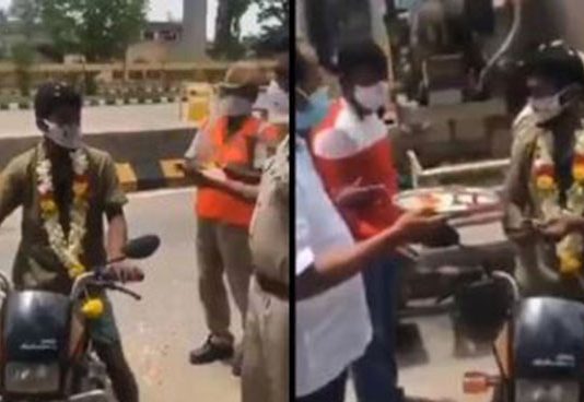 கொரோனா பொதுமுடக்கத்தில் ஹாயாக ஊர் சுற்றிய இளைஞர்… மாலை போட்டு ஆரத்தி எடுத்த போலீசார்!!