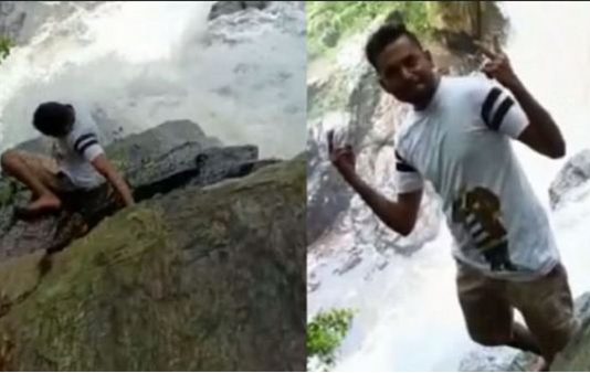 அருவி அருகே கேமராவுக்கு போஸ் கொடுத்த இளைஞர்க்கு நடந்த பரிதாபம் : பதறித் துடித்த நண்பர்கள்!!