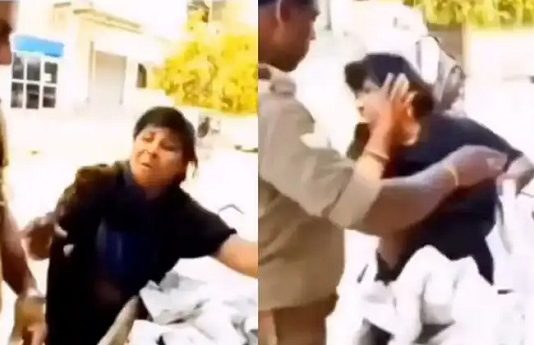 நடுரோட்டில் பெண்ணை கன்னத்தில் அறைந்த காவலர்!!